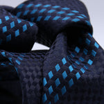 Holliday &amp; Brown - 100th Anniversary Collection
100%&nbsp;Woven Jacquard Silk
Tipped

Blue and Sky Blue motif tie
Handmade in Italy

7.5 cm x 148 cm
#10045