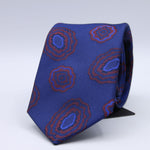Holliday &amp; Brown - 100th Anniversary Collection
100%&nbsp;Woven Jacquard Silk
Tipped

Royal Blue and Rust motif tie
Handmade in Italy

7.5 cm x 148 cm
#10049