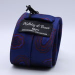 Holliday &amp; Brown - 100th Anniversary Collection
100%&nbsp;Woven Jacquard Silk
Tipped

Royal Blue and Rust motif tie
Handmade in Italy

7.5 cm x 148 cm
#10049