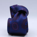 Holliday &amp; Brown - 100th Anniversary Collection
100%&nbsp;Woven Jacquard Silk
Tipped

Royal Blue and Rust motif tie
Handmade in Italy

7.5 cm x 148 cm
#10049