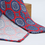 Cruciani &amp; Bella

60% Linen, 40% Silk&nbsp;
Italian fabric

Unlined tie
Red, Blue and Grey Motifs printed tie
Handmade in Italy
8 cm x 150 cm
#10083