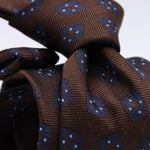 Cruciani &amp; Bella
100% Woven Jacquard Silk
Self-Tipped
Brown, Blue and Light Blue Motif Tie
Made in Italy
8 x 150 cm
#10104