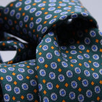 Cruciani &amp; Bella
100% Printed Silk

Self-Tipped
Green, Blue and Orange motif Tie&nbsp;
Handmade in Rome, Italy.

8 cm x 152 cm
#10149