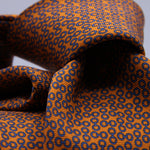 Cruciani &amp; Bella
100% Printed Silk

Self-Tipped
Orange and Royal Blue motif Tie&nbsp;
Handmade in Rome, Italy.

8,5 cm x 152 cm
#10156