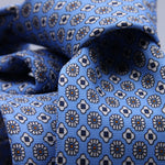 Cruciani &amp; Bella
100% Printed Silk

Self-Tipped
Light Blue, White, Blue and Orange motif Tie&nbsp;
Handmade in Rome, Italy.

8,5 cm x 152 cm
#10161