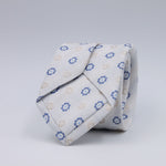 Cruciani &amp; Bella
100% Woven Jacquard Silk, Cotton and Linen
Off-White, Blue and Light Beige Motif Tie
Self-Tipped

Made in Italy
8 x 150 cm
#10212