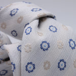 Cruciani &amp; Bella
100% Woven Jacquard Silk, Cotton and Linen
Off-White, Blue and Light Beige Motif Tie
Self-Tipped

Made in Italy
8 x 150 cm
#10212