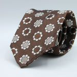 Cruciani &amp; Bella
100% Woven Silk Jacquard
Unlined
Seven Folds
Brown and Off-White motif tie
Handmade in Italy
8 cm x 149 cm
#3102