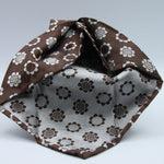 Cruciani &amp; Bella
100% Woven Silk Jacquard
Unlined
Seven Folds
Brown and Off-White motif tie
Handmade in Italy
8 cm x 149 cm
#3102