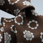 Cruciani &amp; Bella
100% Woven Silk Jacquard
Unlined
Seven Folds
Brown and Off-White motif tie
Handmade in Italy
8 cm x 149 cm
#3102