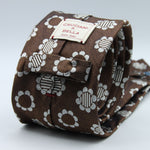 Cruciani &amp; Bella
100% Woven Silk Jacquard
Unlined
Seven Folds
Brown and Off-White motif tie
Handmade in Italy
8 cm x 149 cm
#3102