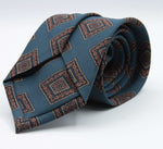 Holliday &amp; Brown for Cruciani &amp; Bella
100% printed Madder Silk
Self Tipped
Denim Blue, Brown, Dark Blue and Yellow motif Tie
Handmade in Italy
8 cm x 150 cm
#8955