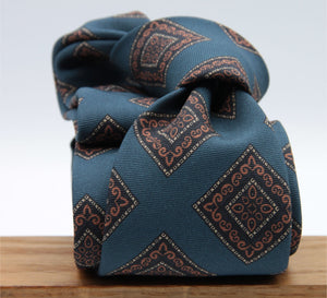 Holliday &amp; Brown for Cruciani &amp; Bella
100% printed Madder Silk
Self Tipped
Denim Blue, Brown, Dark Blue and Yellow motif Tie
Handmade in Italy
8 cm x 150 cm
#8955