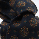 Cruciani &amp; Bella
Printed and Handmade in Italy
100% Wool
Unlined
Blue, Brown, Beige and Orange Motif Tie
8 cm x 150 cm
#9126
