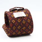 Cruciani &amp; Bella
Printed and Handmade in Italy
100% Wool
Unlined
Burgundy, Orange and Gold Yellow Motif Tie
8 cm x 150 cm
#9164