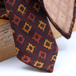 Cruciani &amp; Bella
Printed and Handmade in Italy
100% Wool
Unlined
Burgundy, Orange and Gold Yellow Motif Tie
8 cm x 150 cm
#9164