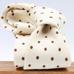 Cruciani &amp; Bella
Printed and Handmade in Italy
100% Wool
Unlined
Off-White and Brown Dots Motif Tie
8 cm x 150 cm
#9173