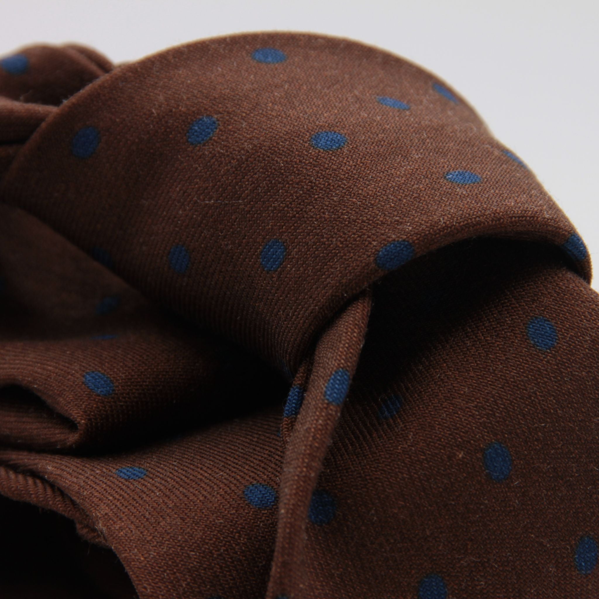 Cruciani &amp; Bella
Printed and Handmade in Italy
100% Wool
Unlined
Brown and Blue Dots Motif Tie
8 cm x 150 cm
#9174