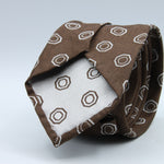 Cruciani &amp; Bella
100% Woven Silk Jacquard
Unlined
Seven Folds
Brown and Off-White motif tie
Handmade in Italy
8 cm x 149 cm
#9678