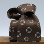 Cruciani &amp; Bella
100% Woven Silk Jacquard
Unlined
Seven Folds
Brown and Off-White motif tie
Handmade in Italy
8 cm x 149 cm
#9678