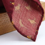 Cruciani &amp; Bella
Printed and Handmade in Italy
100% Wool

Unlined

Red Tie with Light Brown Dogs and Pheasants pattern

#9765