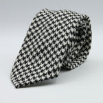 Cruciani &amp; Bella
100% Shetland Wool
White and Black Houndstooth
Unlined Tie
Handmade in Italy
#9798
Suggested knot: Four-in-hand