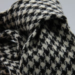 Cruciani &amp; Bella
100% Shetland Wool
White and Black Houndstooth
Unlined Tie
Handmade in Italy
#9798
Suggested knot: Four-in-hand