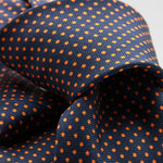 Cruciani &amp; Bella
100% Printed Silk

Self-Tipped
Navy Blue and Orange Pindots Tie&nbsp;
Handmade in Rome, Italy.

8 cm x 150 cm
#9843