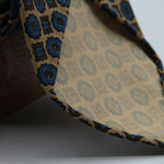 Cruciani &amp; Bella

100% Printed Madder Silk&nbsp;
Italian fabric

Unlined tie
Beige, Brown and Blue Printed Motif Tie

Handmade in Italy
8 cm x 150 cm
#9994