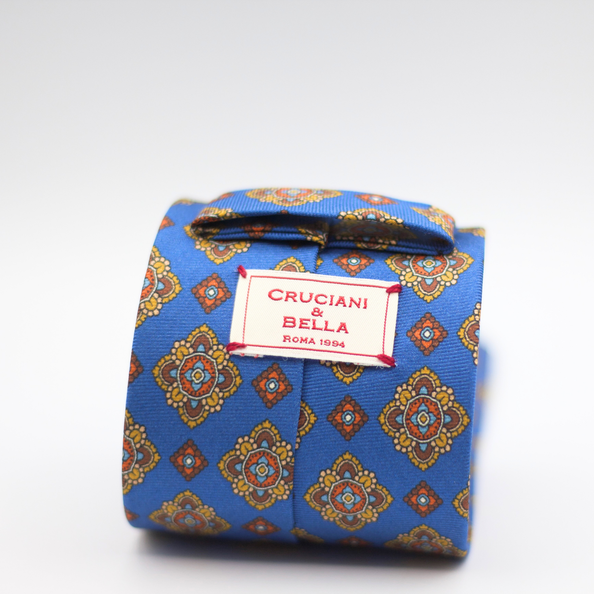 Cruciani & Bella 100% Silk Printed Self-Tipped Blue, Brown, Light Brown and Orange Motif Tie Handmade in Rome, Italy. 8 cm x 150 cm