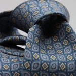 Cruciani &amp; Bella
100% Printed Silk

Self-Tipped
Blue, Grey and Yerllow Motif Tie&nbsp;
Handmade in Rome, Italy.

8 cm x 150 cm
#9295