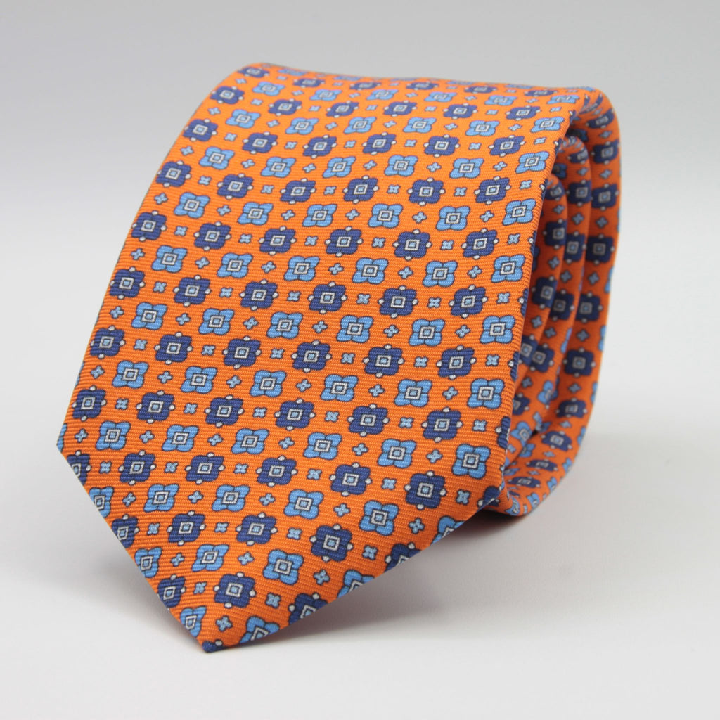 Cruciani &amp; Bella
100% Printed Silk

Self-Tipped
Orange, Blue, Light Blue and White Motif Tie&nbsp;
Handmade in Rome, Italy.

8 cm x 150 cm
#9298