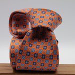 Cruciani &amp; Bella
100% Printed Silk

Self-Tipped
Orange, Blue, Light Blue and White Motif Tie&nbsp;
Handmade in Rome, Italy.

8 cm x 150 cm
#9298