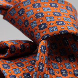 Cruciani &amp; Bella
100% Printed Silk

Self-Tipped
Orange, Blue, Light Blue and White Motif Tie&nbsp;
Handmade in Rome, Italy.

8 cm x 150 cm
#9298