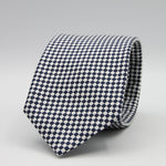 Cruciani &amp; Bella

100% Woven Jacquard Silk
Tipped
3-Folds High
White and dark Blue Optical Motif Tie
Handmade in Como, Italy
8 cm x 150 cm
#7877