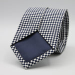 Cruciani &amp; Bella

100% Woven Jacquard Silk
Tipped
3-Folds High
White and dark Blue Optical Motif Tie
Handmade in Como, Italy
8 cm x 150 cm
#7877