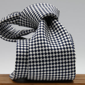 Cruciani &amp; Bella

100% Woven Jacquard Silk
Tipped
3-Folds High
White and dark Blue Optical Motif Tie
Handmade in Como, Italy
8 cm x 150 cm
#7877