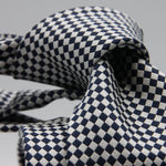 Cruciani &amp; Bella

100% Woven Jacquard Silk
Tipped
3-Folds High
White and dark Blue Optical Motif Tie
Handmade in Como, Italy
8 cm x 150 cm
#7877