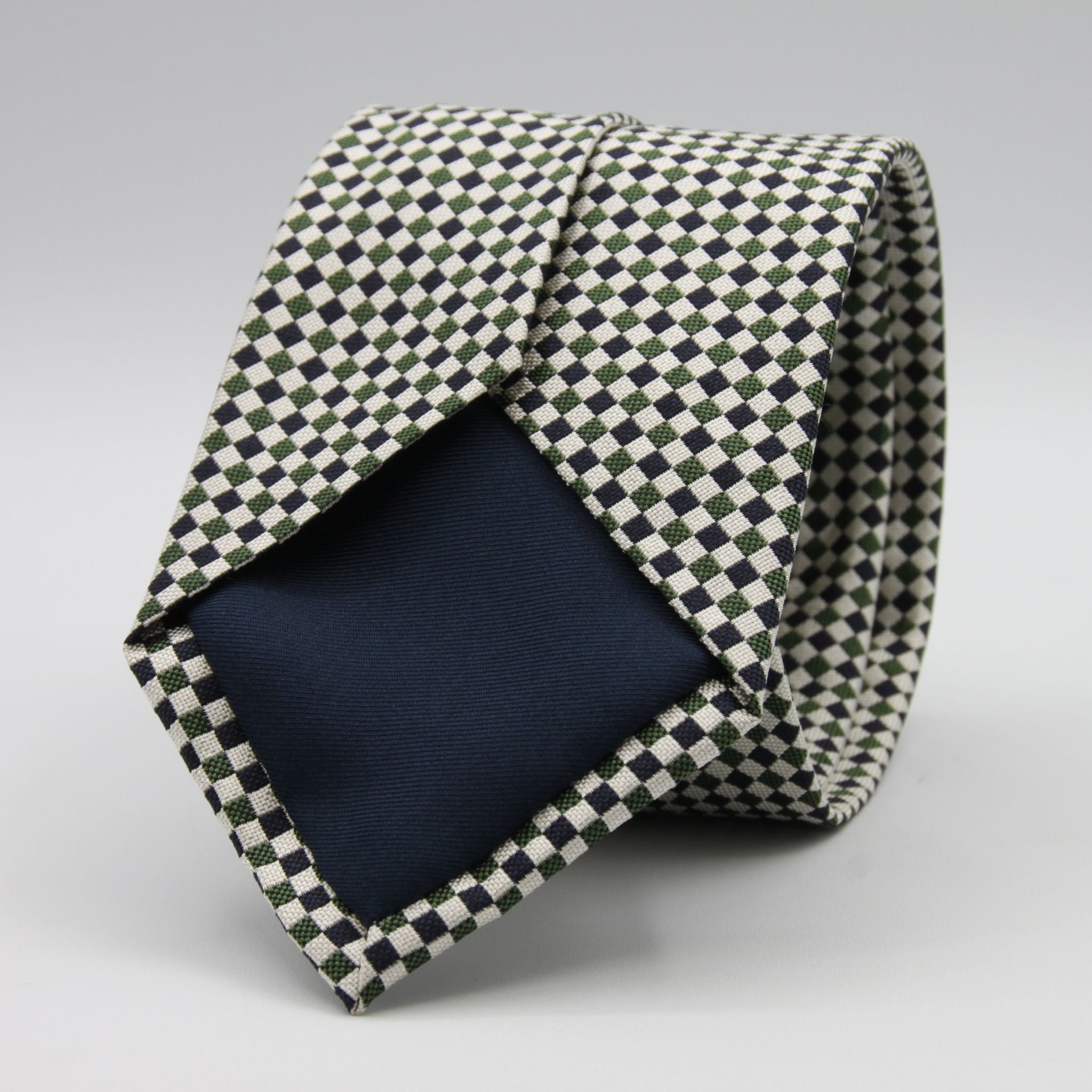 Cruciani &amp; Bella

100% Woven Jacquard silk
Tipped

Green, Off White and Blue Optical Motif Tie
Handmade in Como, Italy
8 cm x 150 cm
#8805