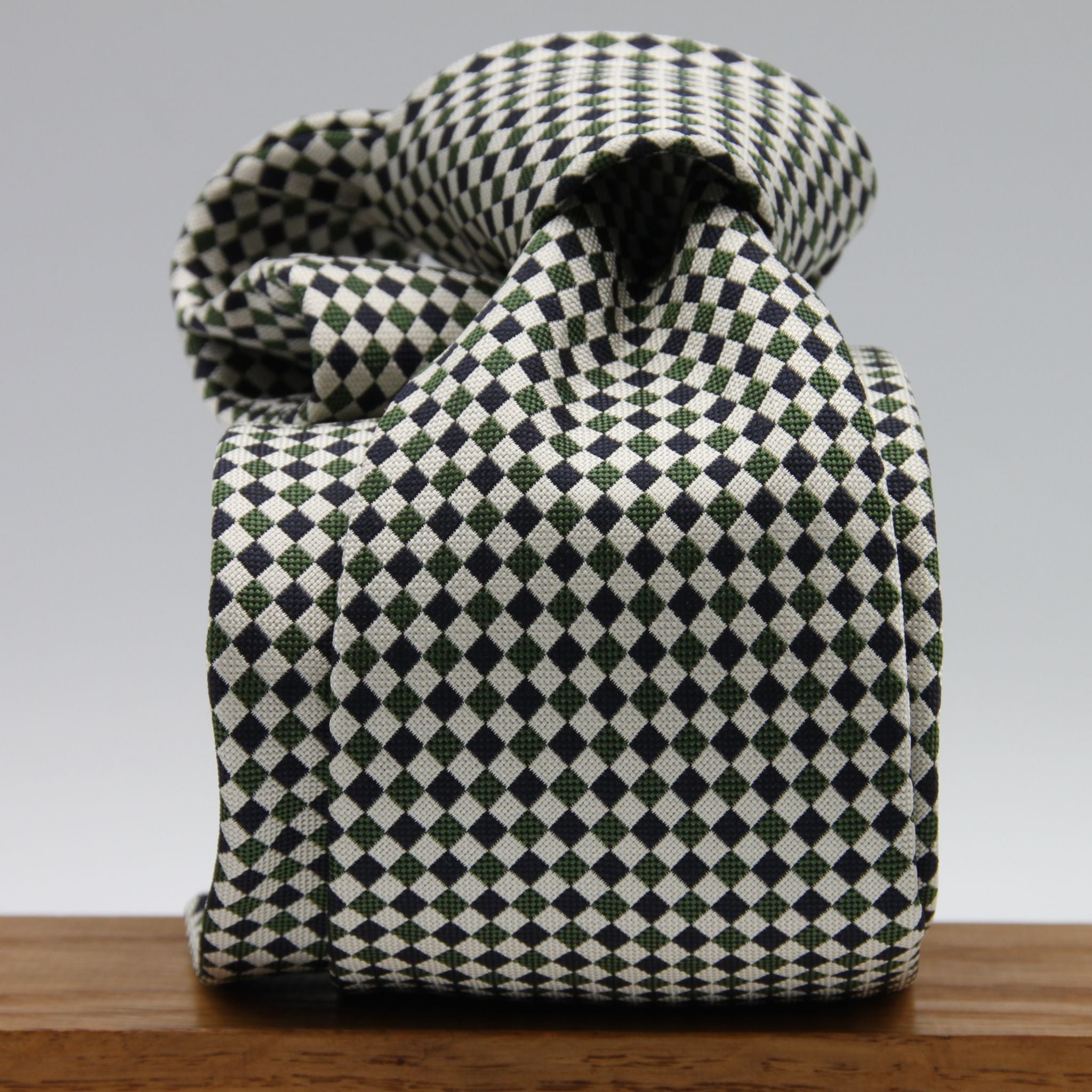 Cruciani &amp; Bella

100% Woven Jacquard silk
Tipped

Green, Off White and Blue Optical Motif Tie
Handmade in Como, Italy
8 cm x 150 cm
#8805