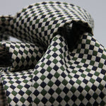 Cruciani &amp; Bella

100% Woven Jacquard silk
Tipped

Green, Off White and Blue Optical Motif Tie
Handmade in Como, Italy
8 cm x 150 cm
#8805