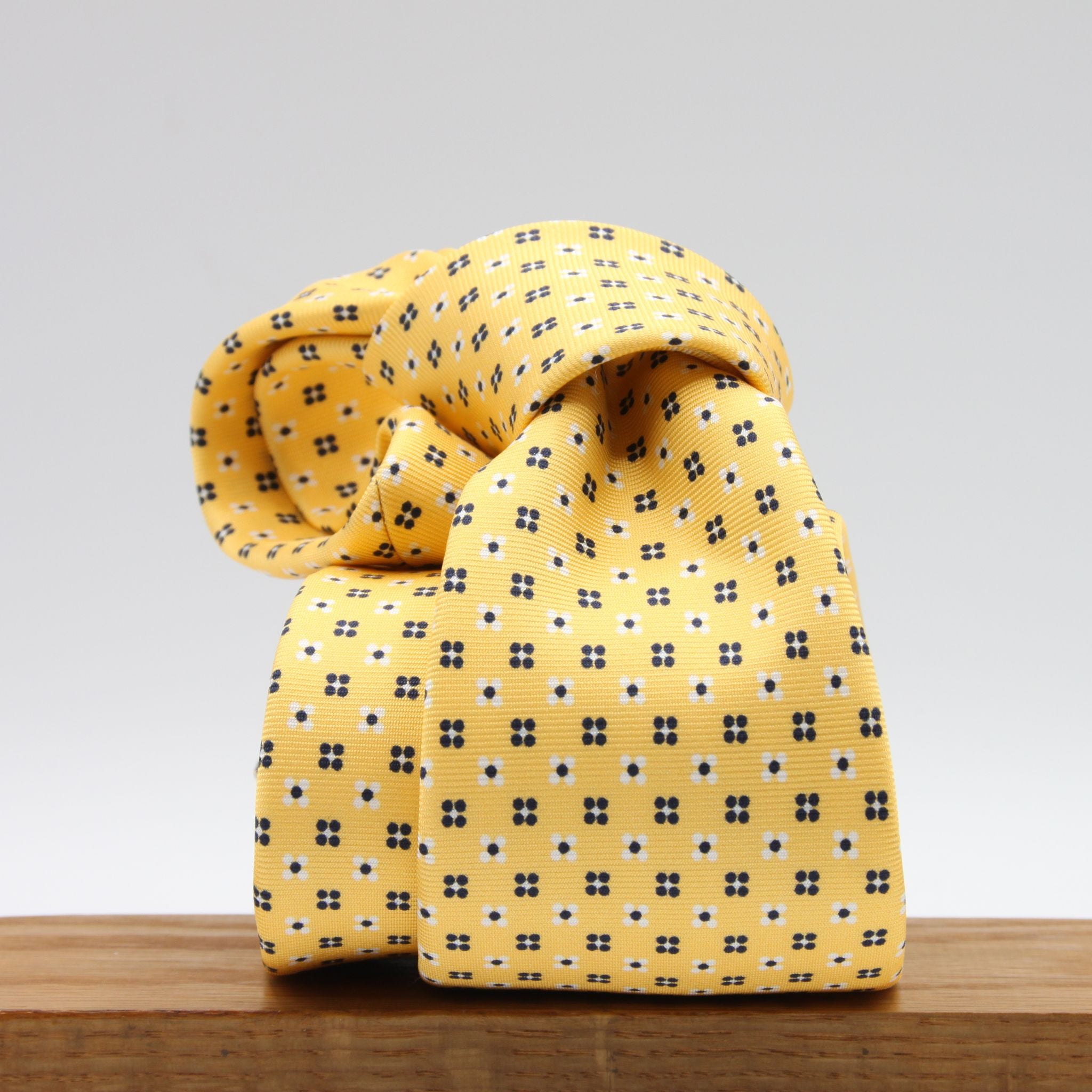 Cruciani &amp; Bella
100% Printed Silk

Self-Tipped
Yellow, White and Blue Motif Tie
Handmade in Rome, Italy.
8 cm x 150 cm
#9428