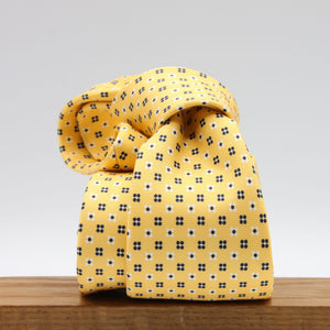 Cruciani &amp; Bella
100% Printed Silk

Self-Tipped
Yellow, White and Blue Motif Tie
Handmade in Rome, Italy.
8 cm x 150 cm
#9428
