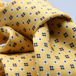 Cruciani &amp; Bella
100% Printed Silk

Self-Tipped
Yellow, White and Blue Motif Tie
Handmade in Rome, Italy.
8 cm x 150 cm
#9428