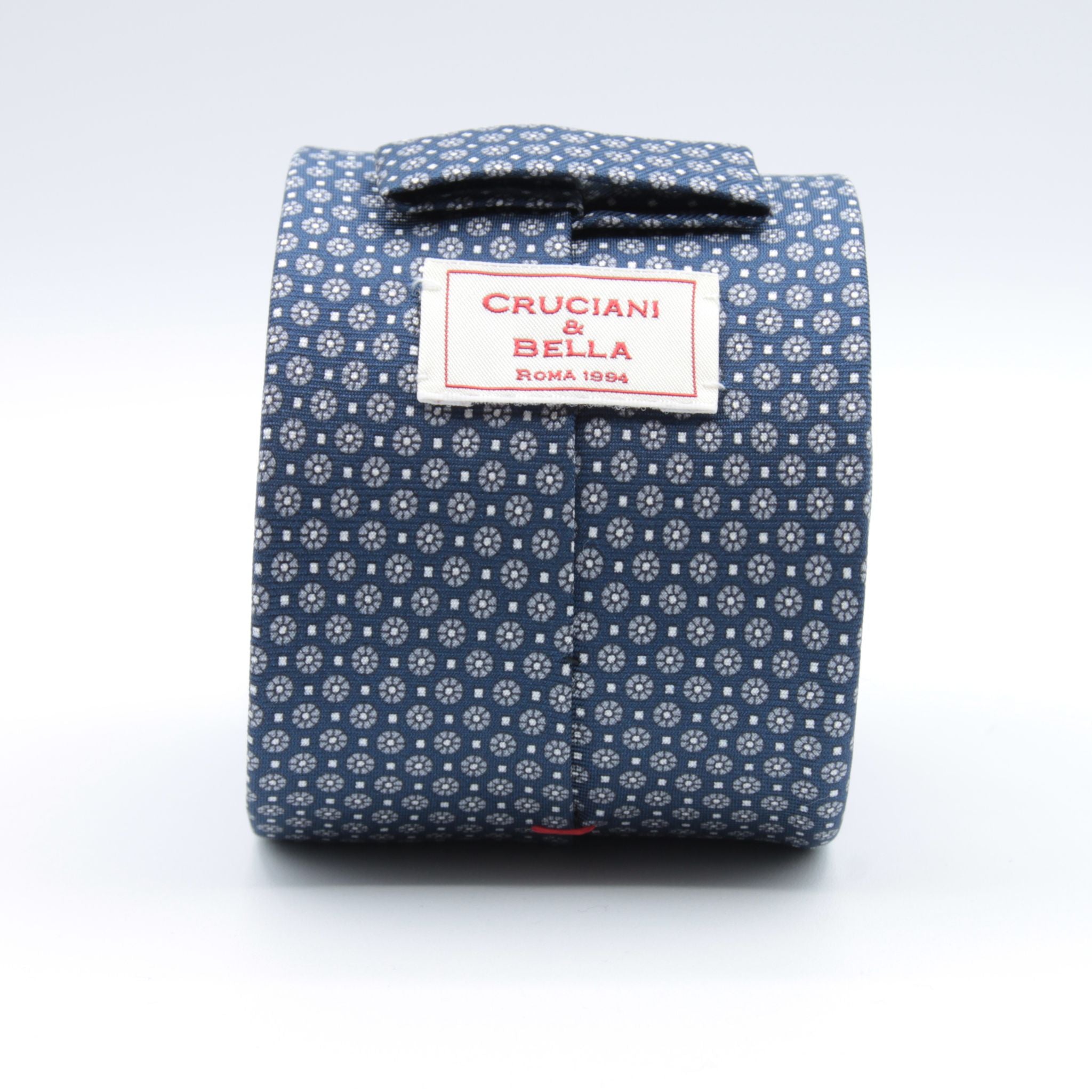 Cruciani &amp; Bella
100% Printed Silk

Self-Tipped
Blue, Grey and White Motif Tie&nbsp;
Handmade in Rome, Italy.

8 cm x 150 cm
#9284