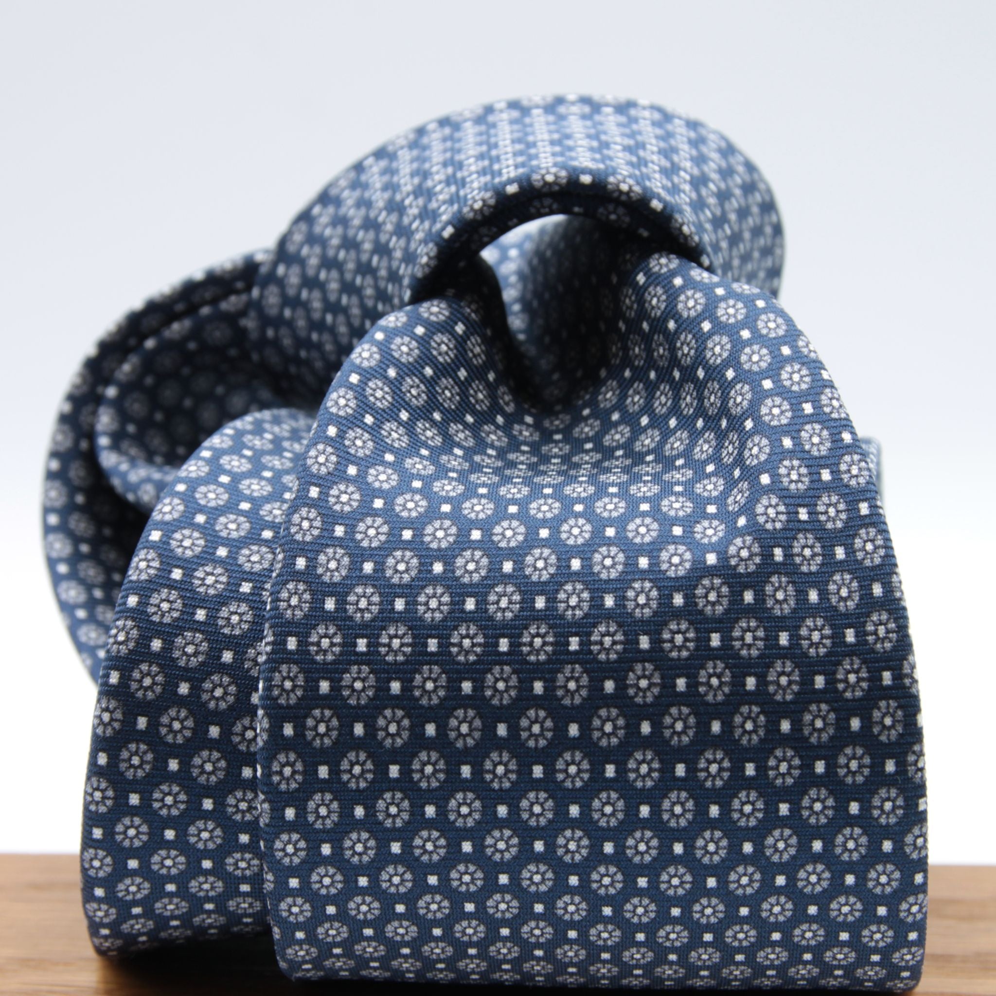 Cruciani &amp; Bella
100% Printed Silk

Self-Tipped
Blue, Grey and White Motif Tie&nbsp;
Handmade in Rome, Italy.

8 cm x 150 cm
#9284