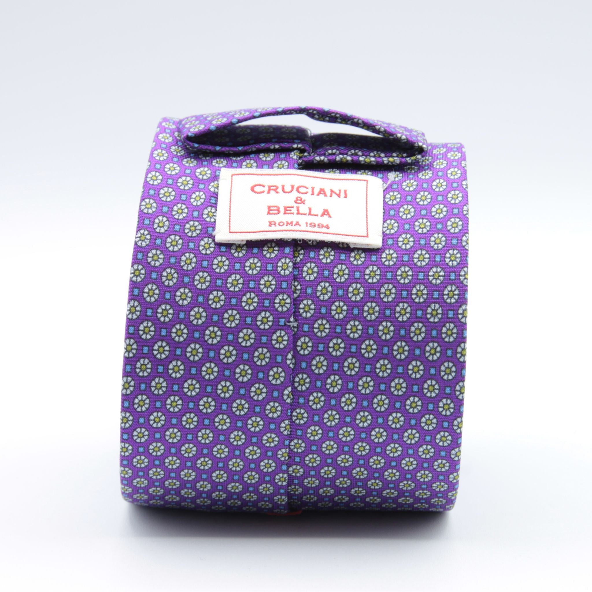 Cruciani &amp; Bella
100% Printed Silk

Self-Tipped
Violet, Off-White, Green and Light Blue Motif Tie&nbsp;
Handmade in Rome, Italy.

8 cm x 150 cm
#9285