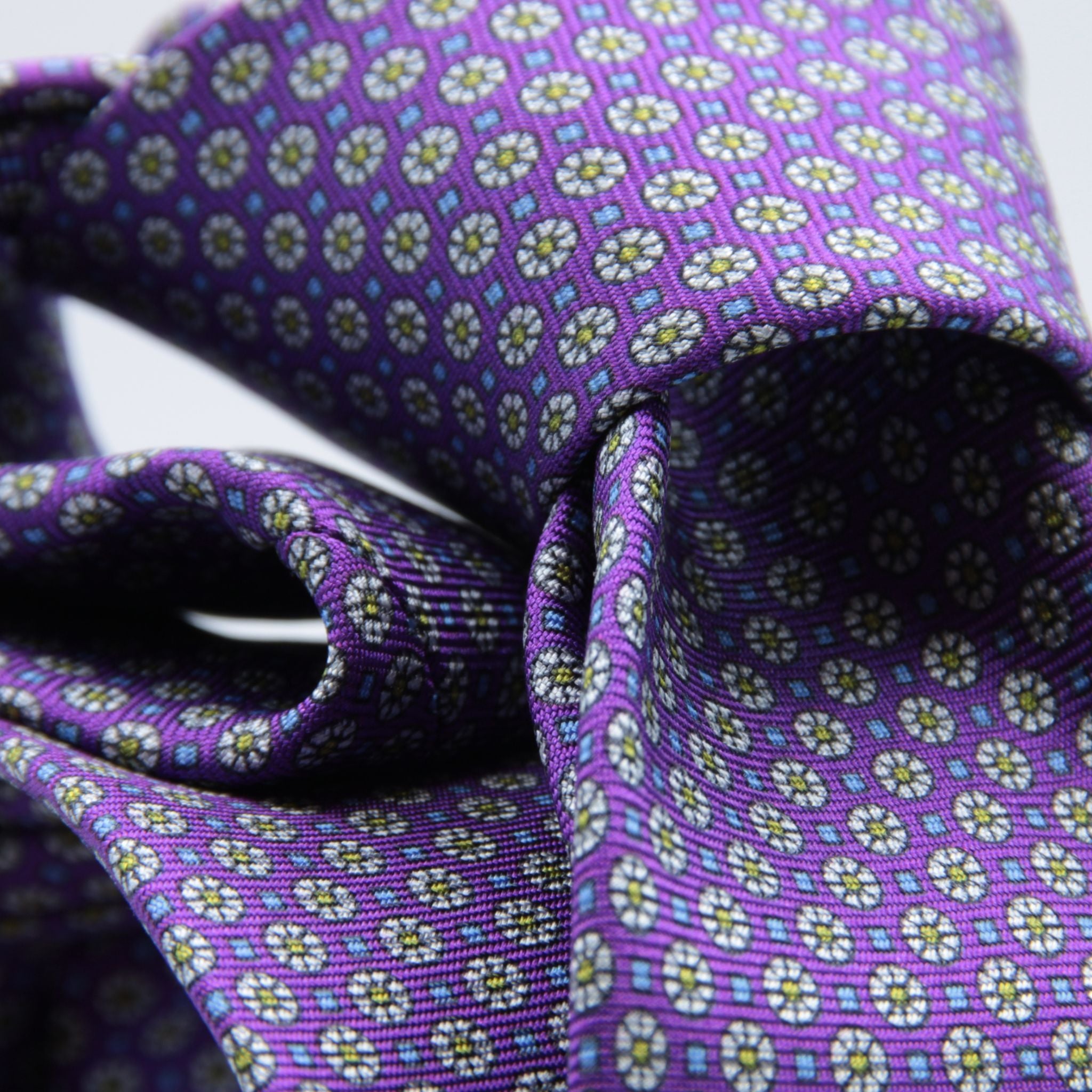 Cruciani &amp; Bella
100% Printed Silk

Self-Tipped
Violet, Off-White, Green and Light Blue Motif Tie&nbsp;
Handmade in Rome, Italy.

8 cm x 150 cm
#9285