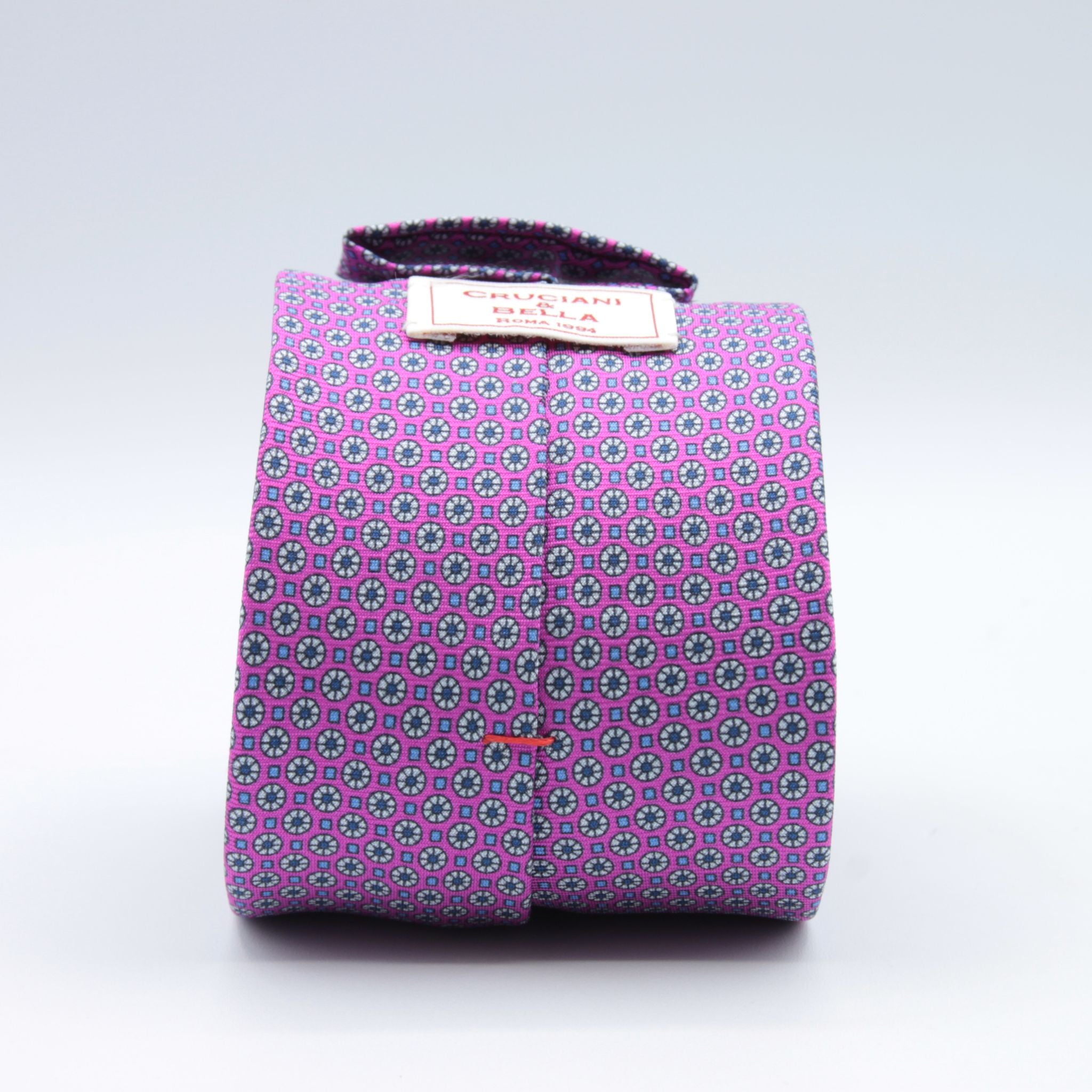 Cruciani &amp; Bella
100% Printed Silk

Self-Tipped
Fucsia, Light Grey, Light Blue and Blue Motif Tie&nbsp;
Handmade in Rome, Italy.

8 cm x 150 cm
#9287