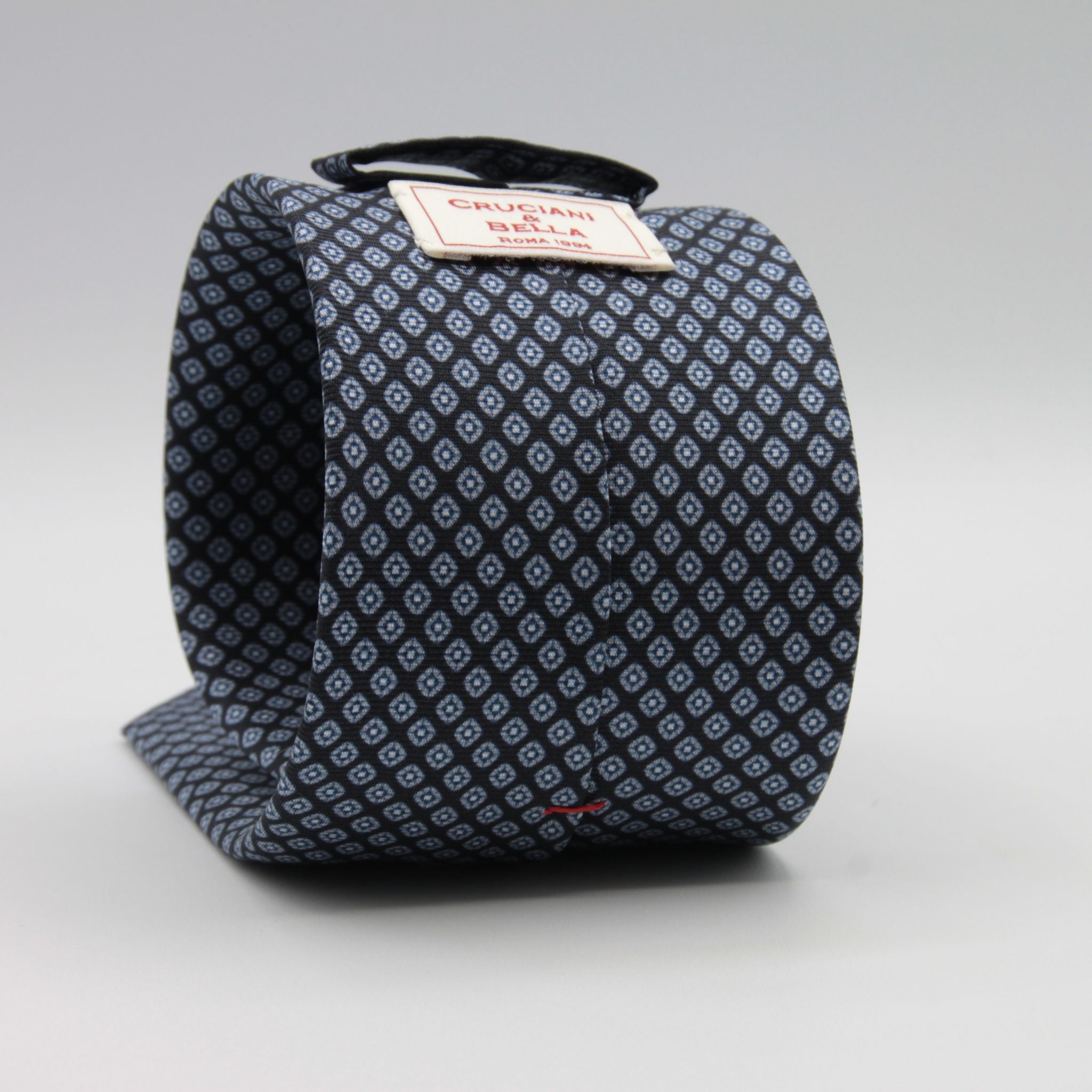 Cruciani &amp; Bella
100% Printed Silk

Self-Tipped
Dark Blue and Grey Motif Tie&nbsp;
Handmade in Rome, Italy.

8 cm x 150 cm
#9290